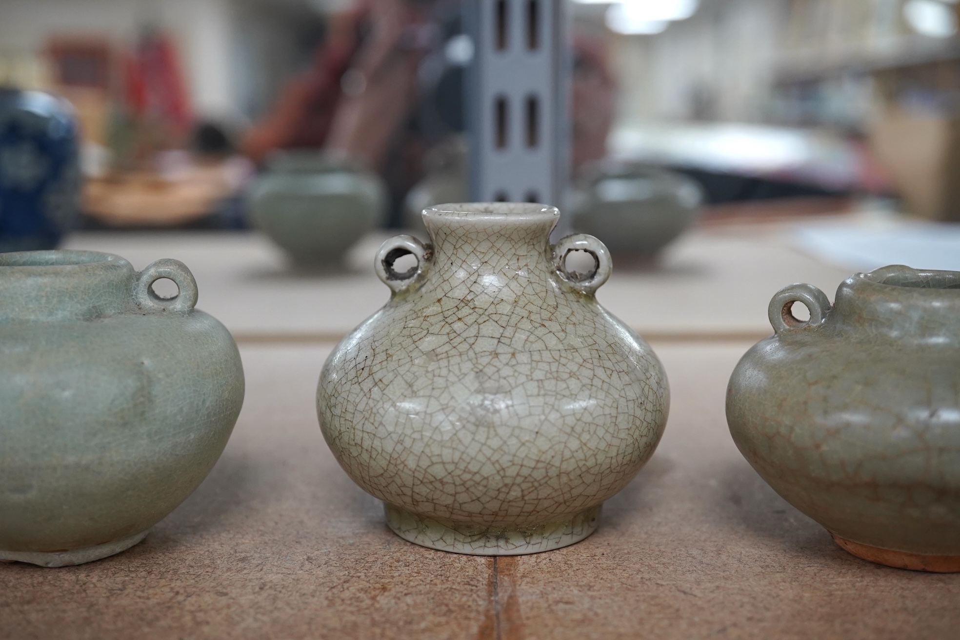 Two Chinese celadon jarlets, Yuan dynasty and a crackle glaze jarlet, tallest 6cm. Condition - good